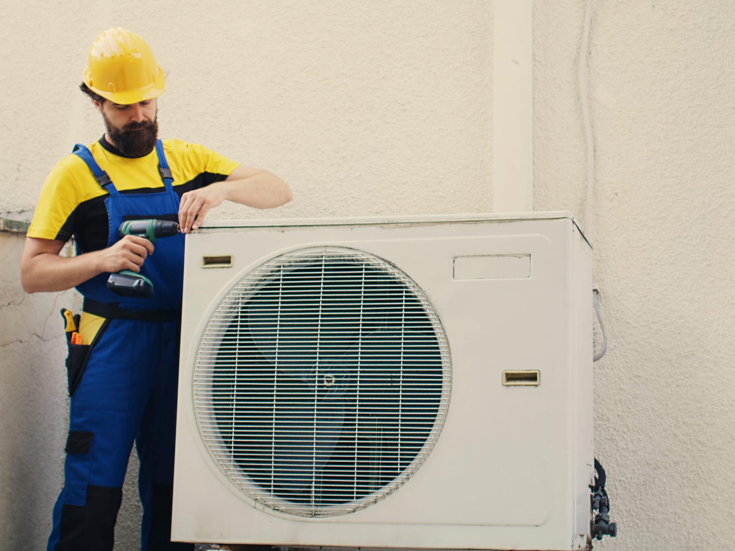 expert wireman works on air conditioner
